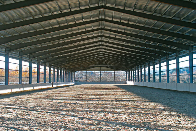 Steel roof-only covered arena with columns and open sides