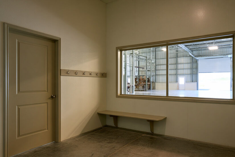 Barndominium interior where the living area meets the shop through a mudroom